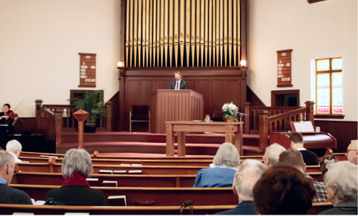 Congregation members talking after Sunday service